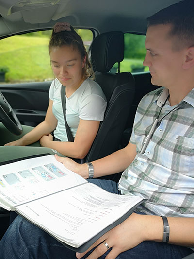 girl with CI and her driving instructor