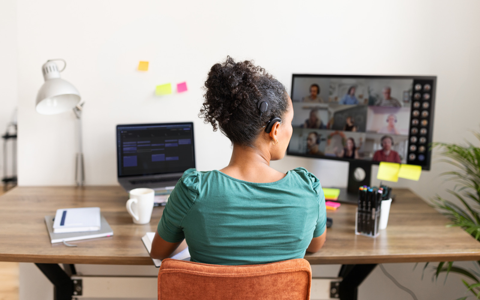 A woman with a CI in a Teams meeting