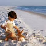 Child explores the beach