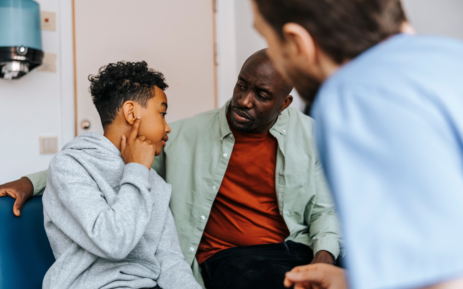 boy with ear infection at ENT doctor with dad