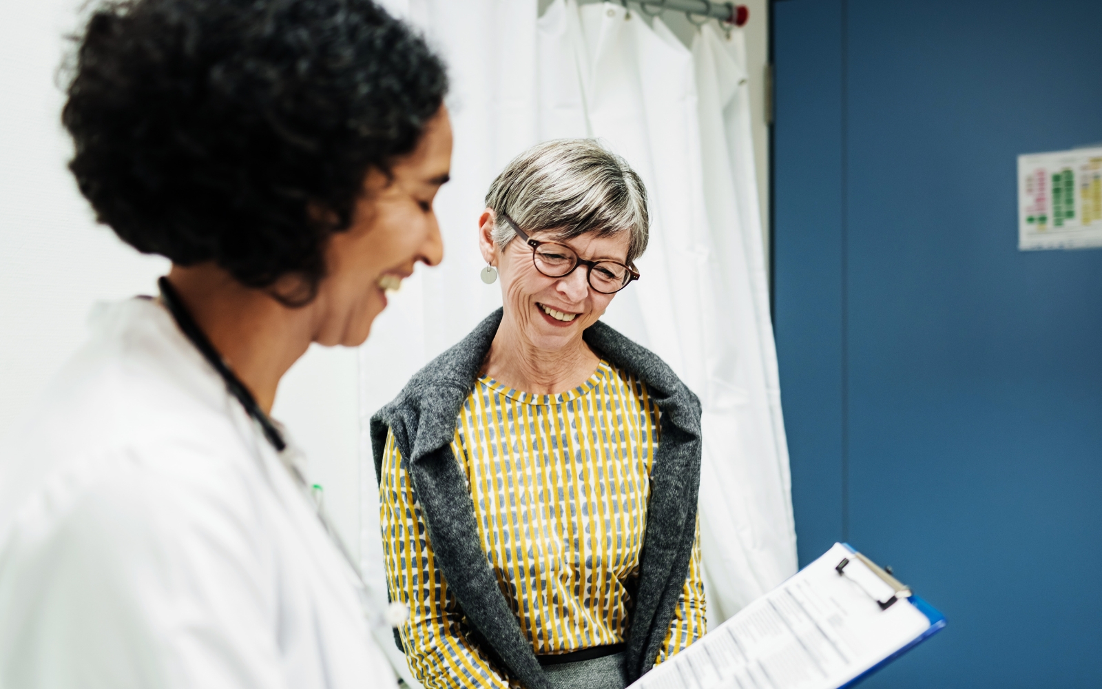 woman receiving hearing test results from ENT doctor