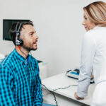 A man doing a hearing test at the ENT