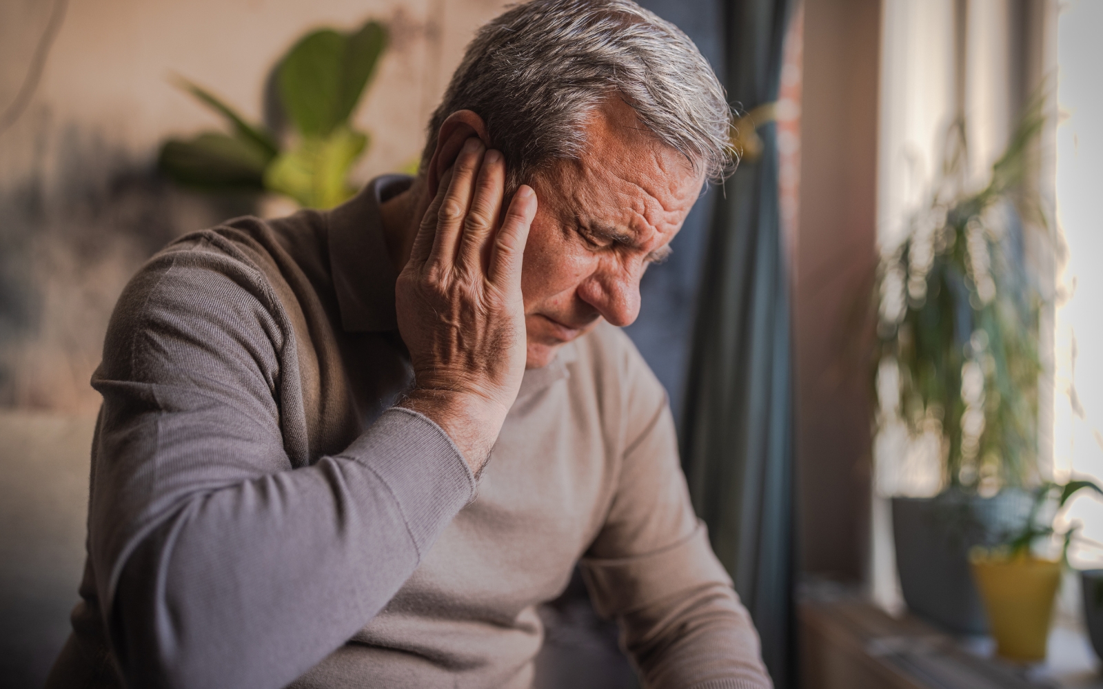 An older man with hearing loss