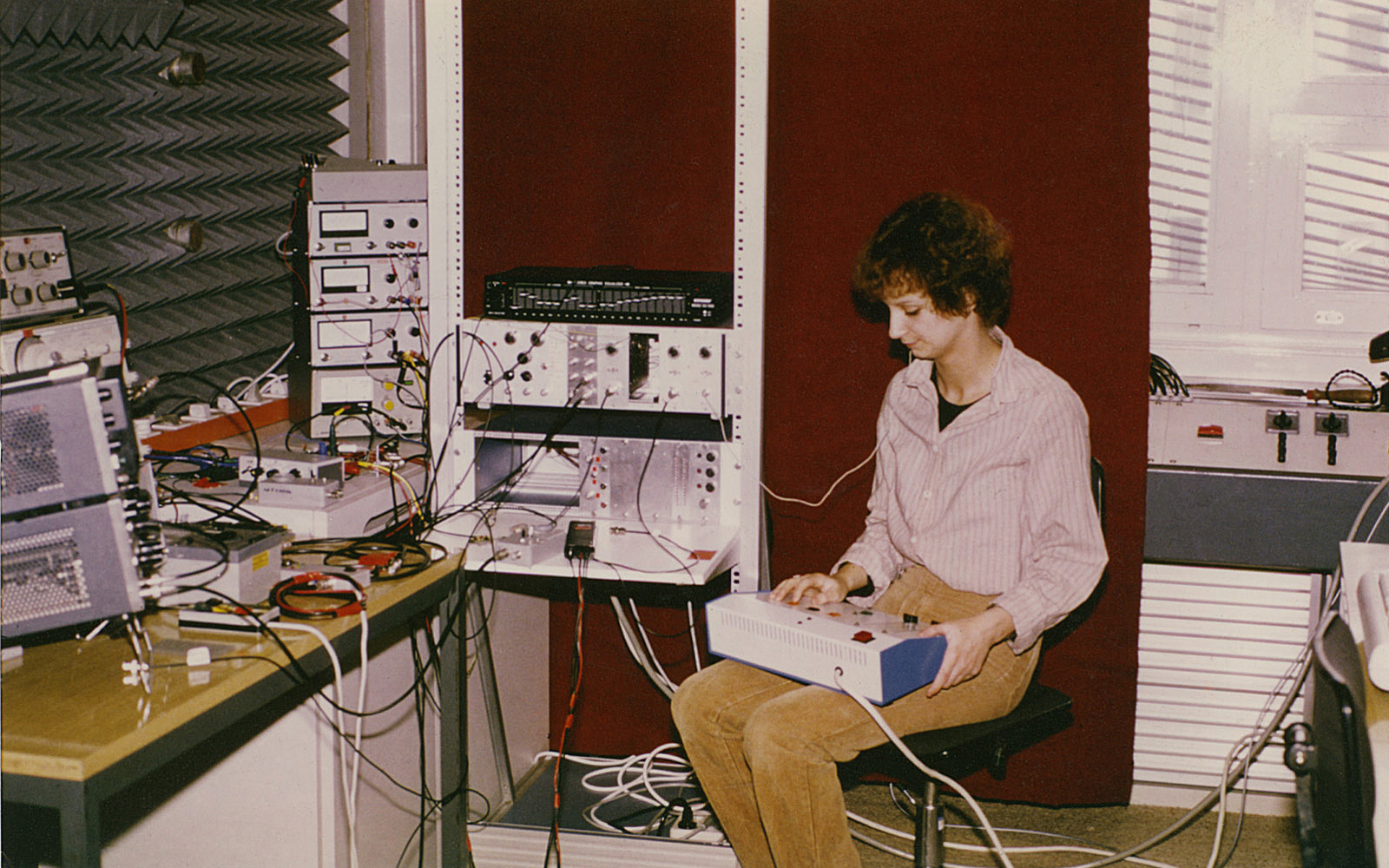 A women tests an early cochlear implant