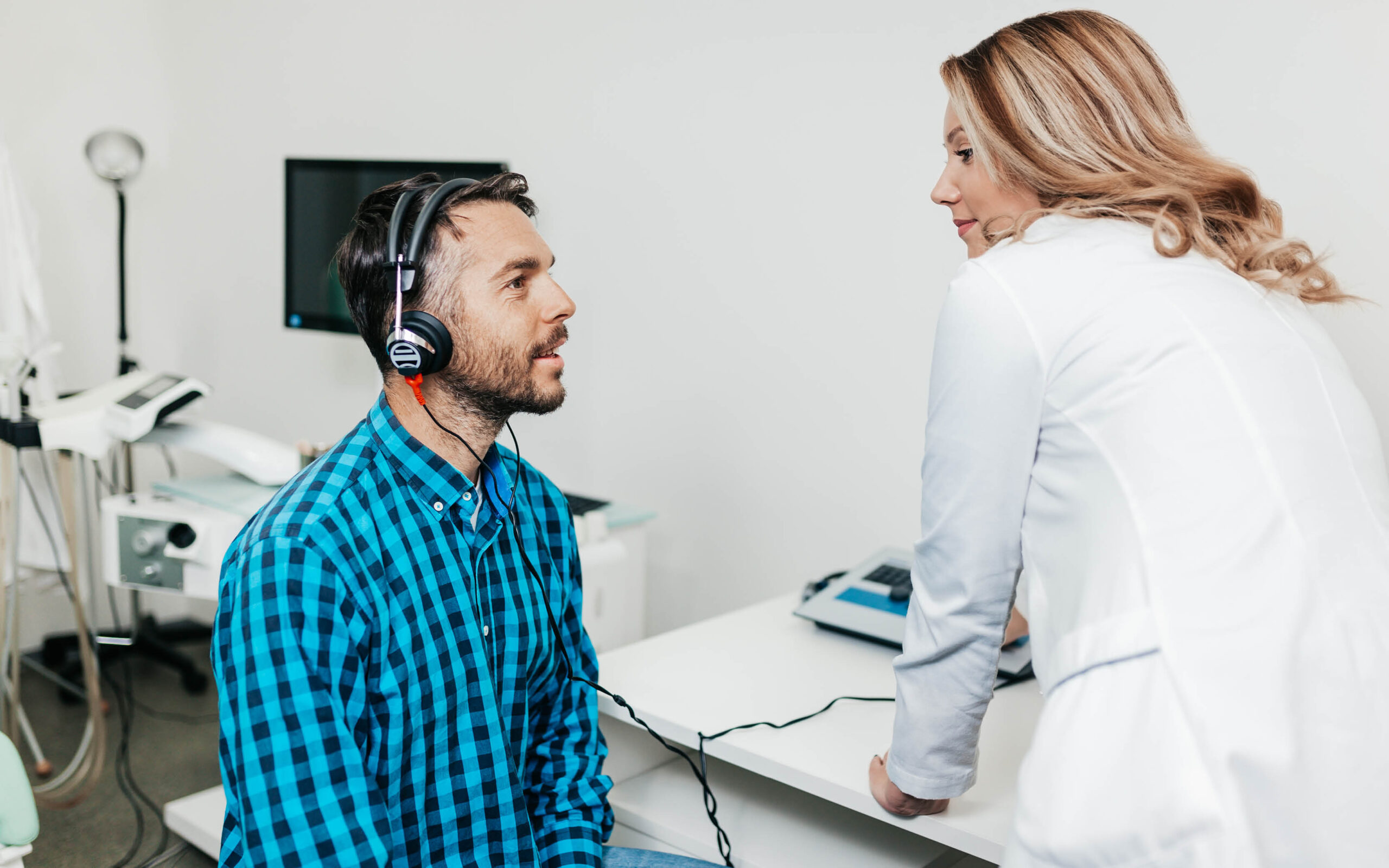 A man doing a hearing test at the ENT