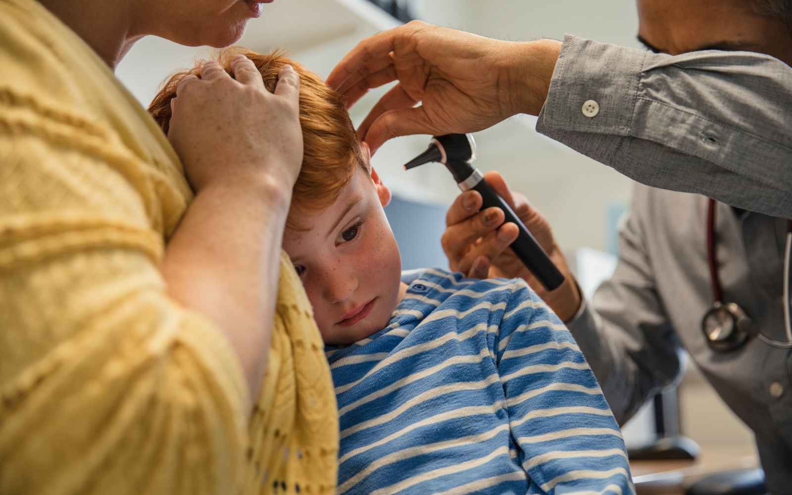 A child doing a hearing test at an ENT