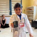 Chanelle holding a cochlear implant