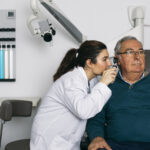 Adult getting a hearing test after noticing signs of hearing loss.